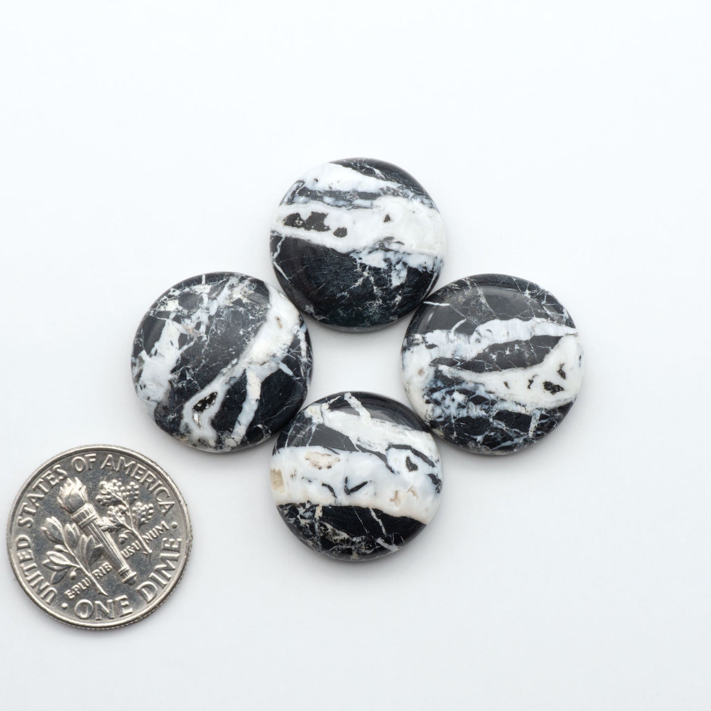 Natural White Buffalo Stone Cabochons are semi-precious gemstones cut into shapes ideal for jewelry-making, making them an excellent choice for artisans.