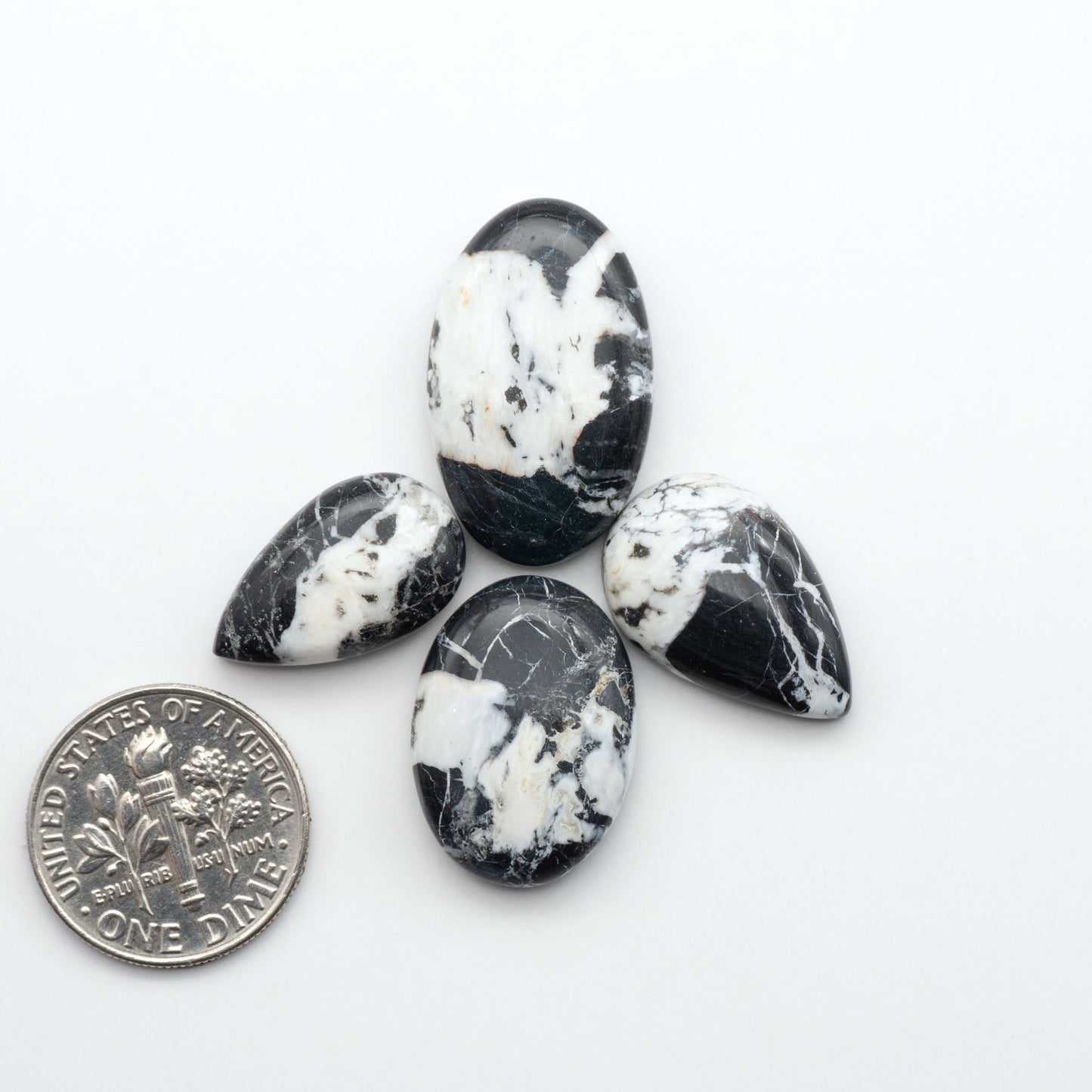 Natural White Buffalo Stone Cabochons are semi-precious gemstones cut into shapes ideal for jewelry-making, making them an excellent choice for artisans.