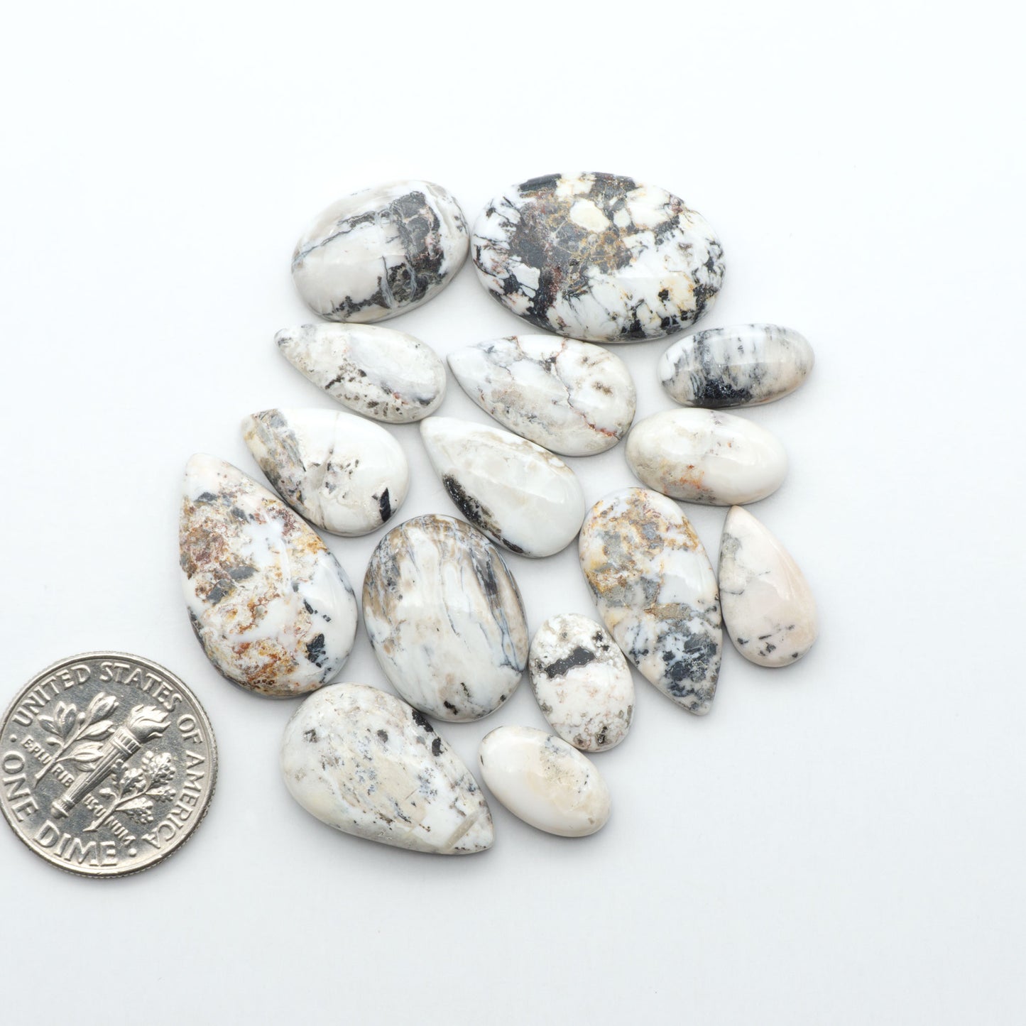 Natural White Buffalo Stone Cabochons are semi-precious gemstones cut into shapes ideal for jewelry-making, making them an excellent choice for artisans.