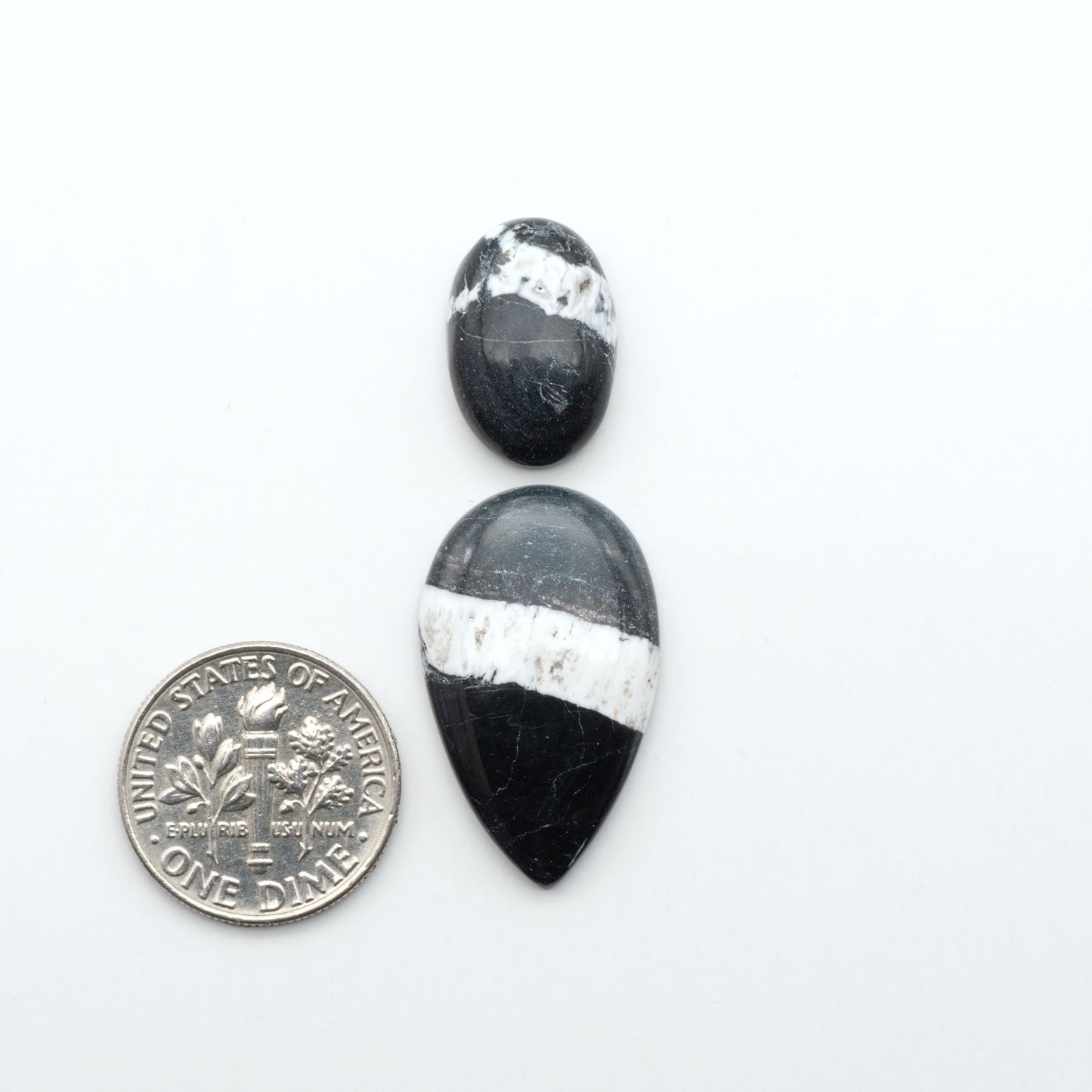 Natural White Buffalo Stone Cabochons are semi-precious gemstones cut into shapes ideal for jewelry-making, making them an excellent choice for artisans.
