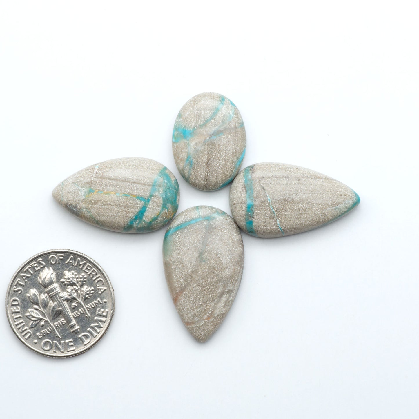 Carico Lake Turquoise cabochons with vibrant aqua-blue to turquoise tones and natural matrix, ideal for rings, pendants, and artisan jewelry.