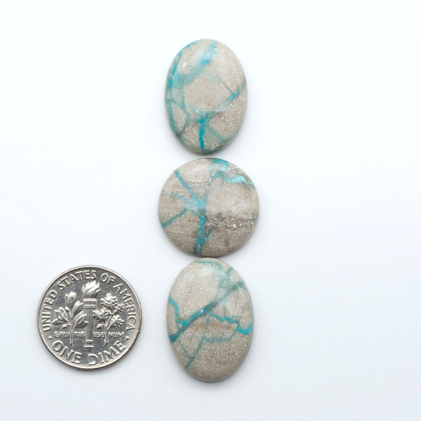 Carico Lake Turquoise cabochons with vibrant aqua-blue to turquoise tones and natural matrix, ideal for rings, pendants, and artisan jewelry.