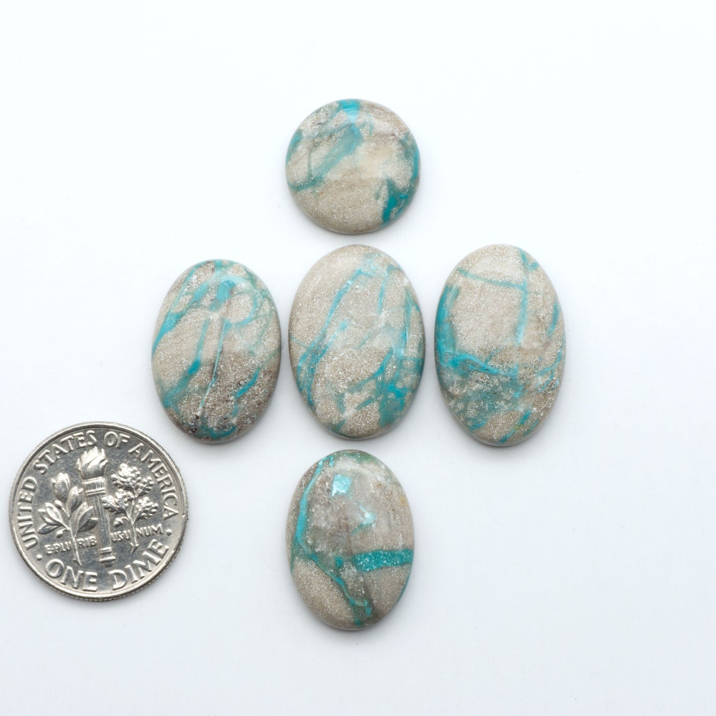 Carico Lake Turquoise cabochons with vibrant aqua-blue to turquoise tones and natural matrix, ideal for rings, pendants, and artisan jewelry.