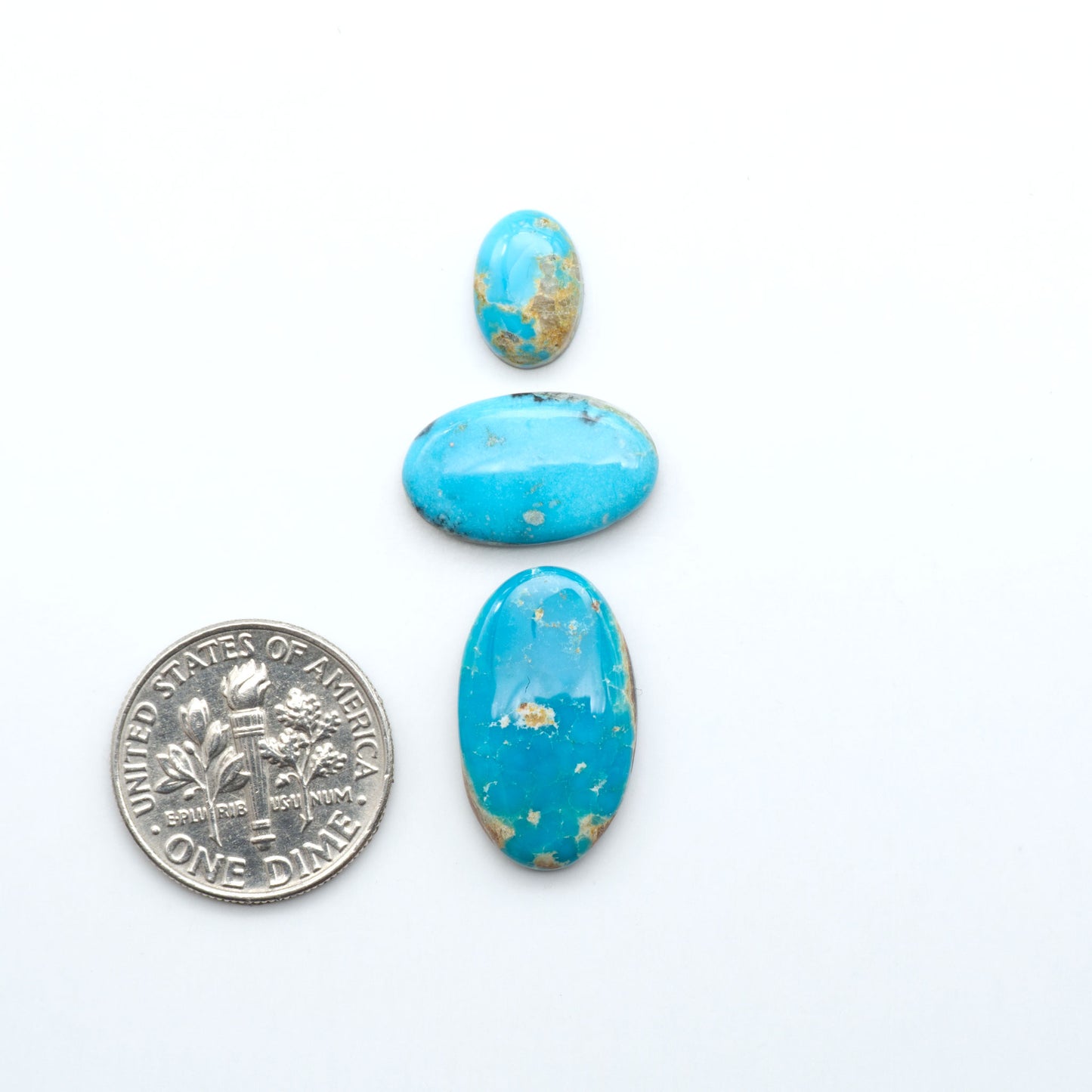 Royston Turquoise cabochons are famous for their distinctive matrix and unique green and blue hues, making them a favored option among jewelry designers.