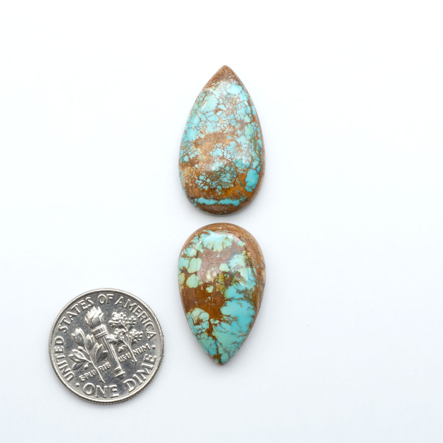 Royston Turquoise cabochons are famous for their distinctive matrix and unique green and blue hues, making them a favored option among jewelry designers.