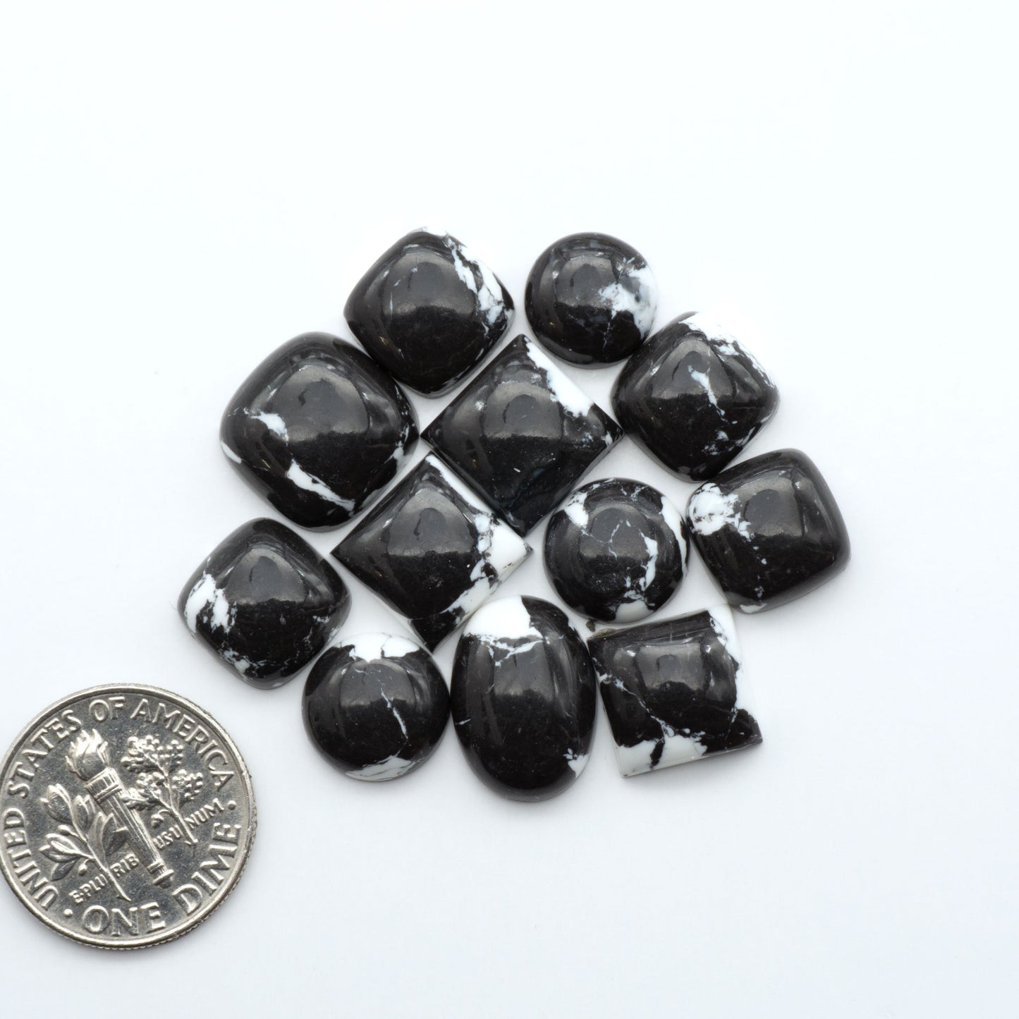 These White Buffalo Cabochons are expertly cut and polished from composite material, resulting in a stunning and long-lasting gemstone.