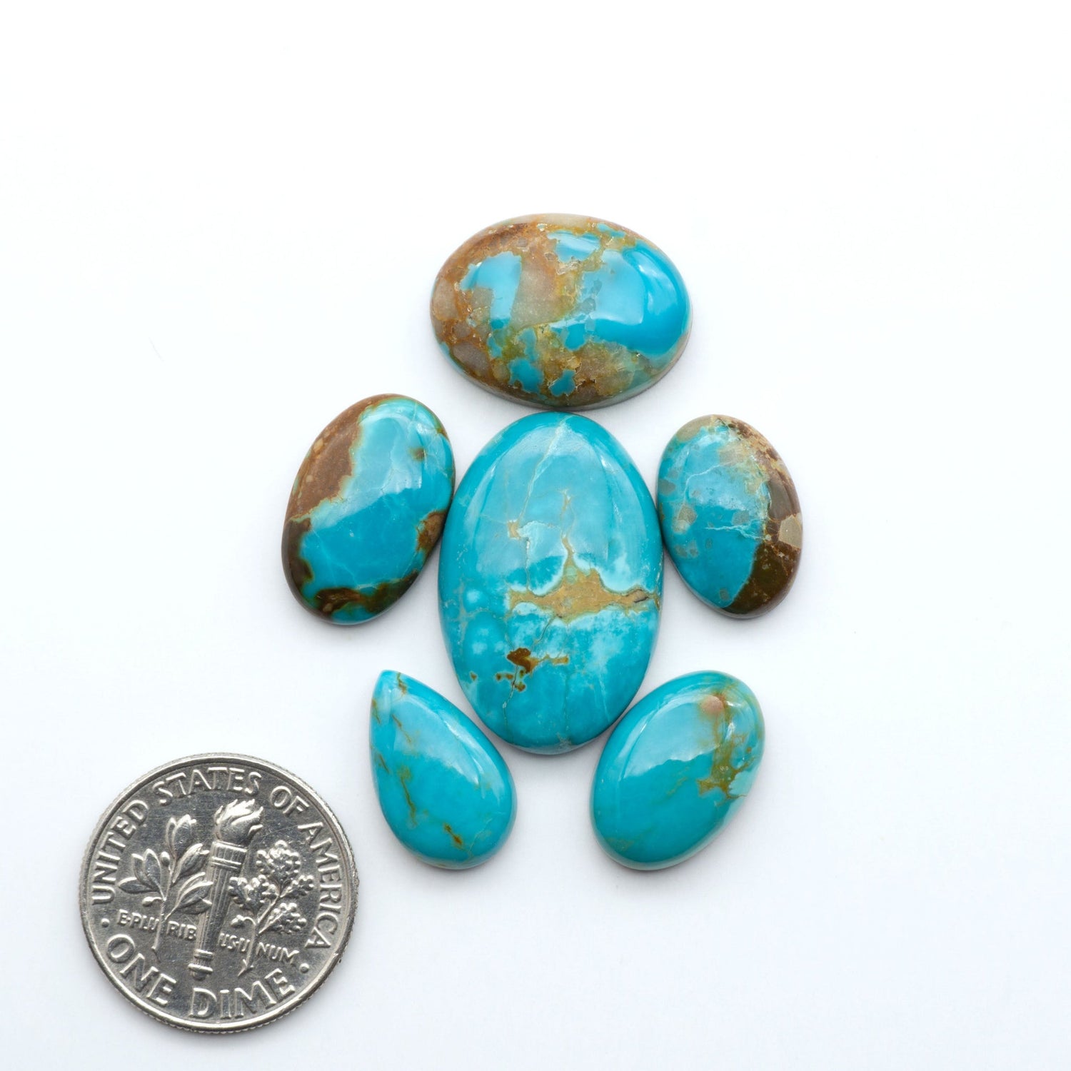 Add a touch of beauty to your collection with our stunning Pilot Mountain Turquoise Cabochons. Perfect for jewelry making each piece is truly one-of-a-kind.
