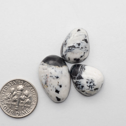 White Buffalo Stone Cabochons are semi-precious gemstones cut into shapes ideal for jewelry-making and crafting. The unique and varied veining of each cabochon lend an unparalleled depth and detail to any project, making them an excellent choice for artisans looking to add an individualistic touch.