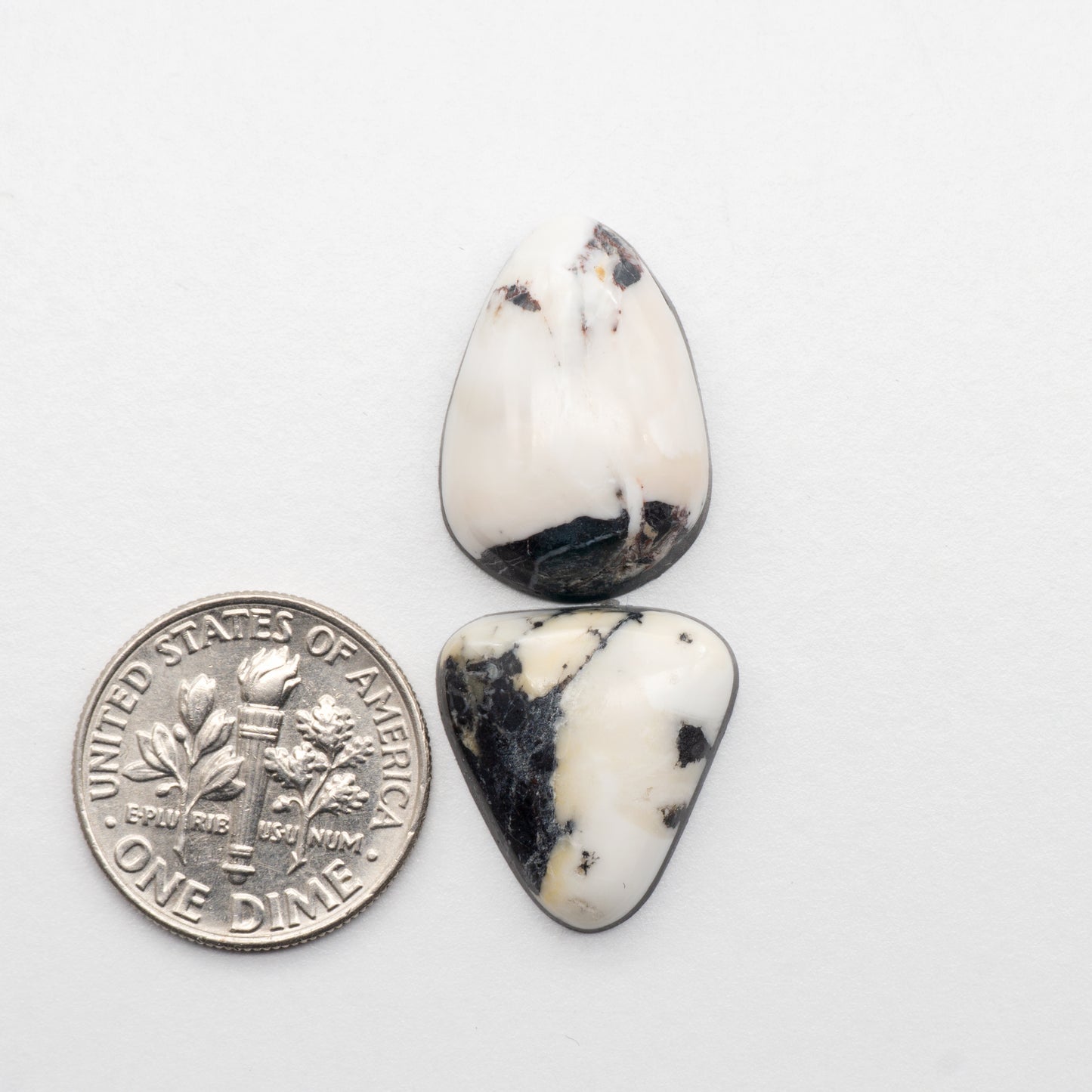 White Buffalo Stone Cabochons are semi-precious gemstones cut into shapes ideal for jewelry-making and crafting. The unique and varied veining of each cabochon lend an unparalleled depth and detail to any project, making them an excellent choice for artisans looking to add an individualistic touch.