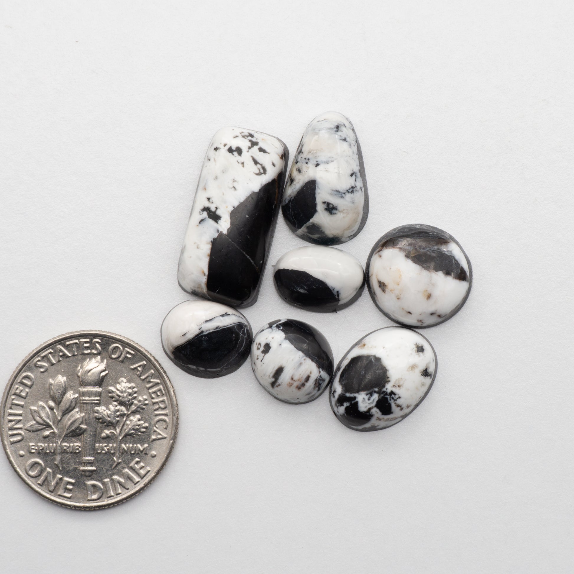White Buffalo Stone Cabochons are semi-precious gemstones cut into shapes ideal for jewelry-making and crafting. The unique and varied veining of each cabochon lend an unparalleled depth and detail to any project, making them an excellent choice for artisans looking to add an individualistic touch.