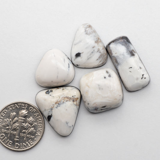White Buffalo Stone Cabochons are semi-precious gemstones cut into shapes ideal for jewelry-making and crafting. The unique and varied veining of each cabochon lend an unparalleled depth and detail to any project, making them an excellent choice for artisans looking to add an individualistic touch.