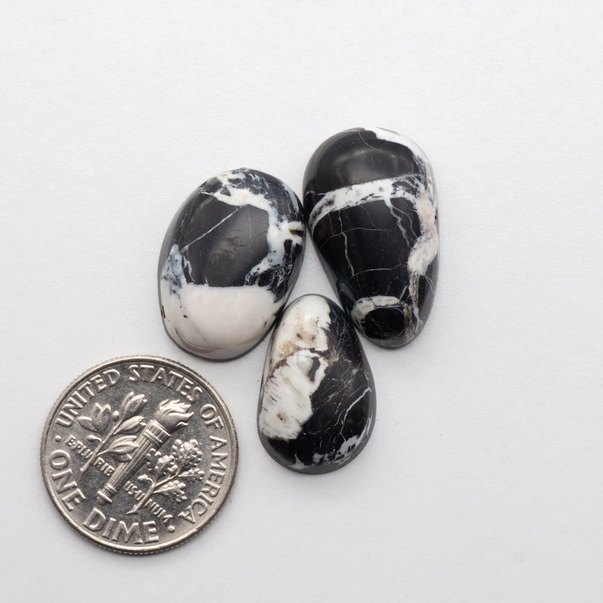 White Buffalo Stone Cabochons are semi-precious gemstones cut into shapes ideal for jewelry-making and crafting. The unique and varied veining of each cabochon lend an unparalleled depth and detail to any project, making them an excellent choice for artisans looking to add an individualistic touch.
