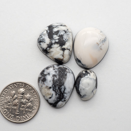 White Buffalo Stone Cabochons are semi-precious gemstones cut into shapes ideal for jewelry-making and crafting. The unique and varied veining of each cabochon lend an unparalleled depth and detail to any project, making them an excellent choice for artisans looking to add an individualistic touch.