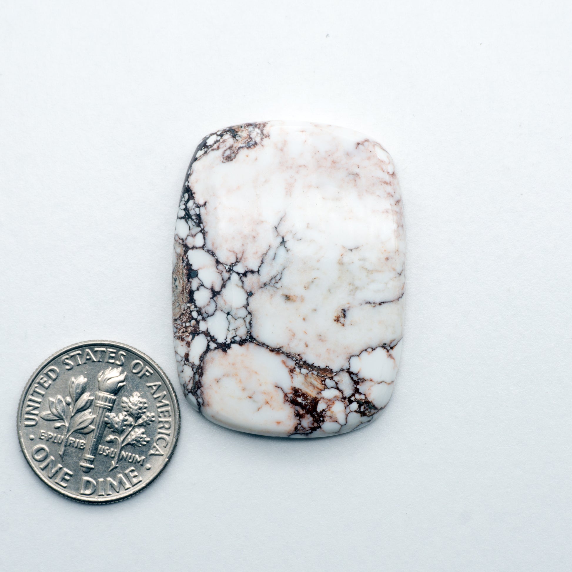 This Natural Wild Horse Cabochon has a glossy finish and is unbacked. This Magnesite stone is mined in Arizona, USA and is similar to turquoise used for jewelry making.