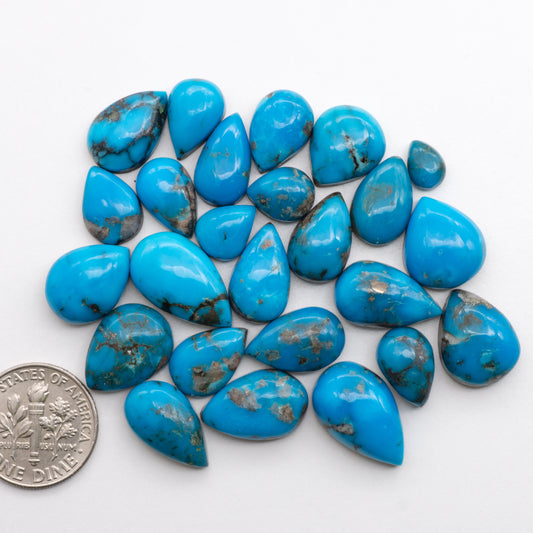 Add unique splashes of color to your jewelry with our Kingman Turquoise Cabochons. Featuring natural blue hues, these cabochons are backed for added strength and offer a beautiful contrast to any design. Perfect for necklaces, earrings, and more!