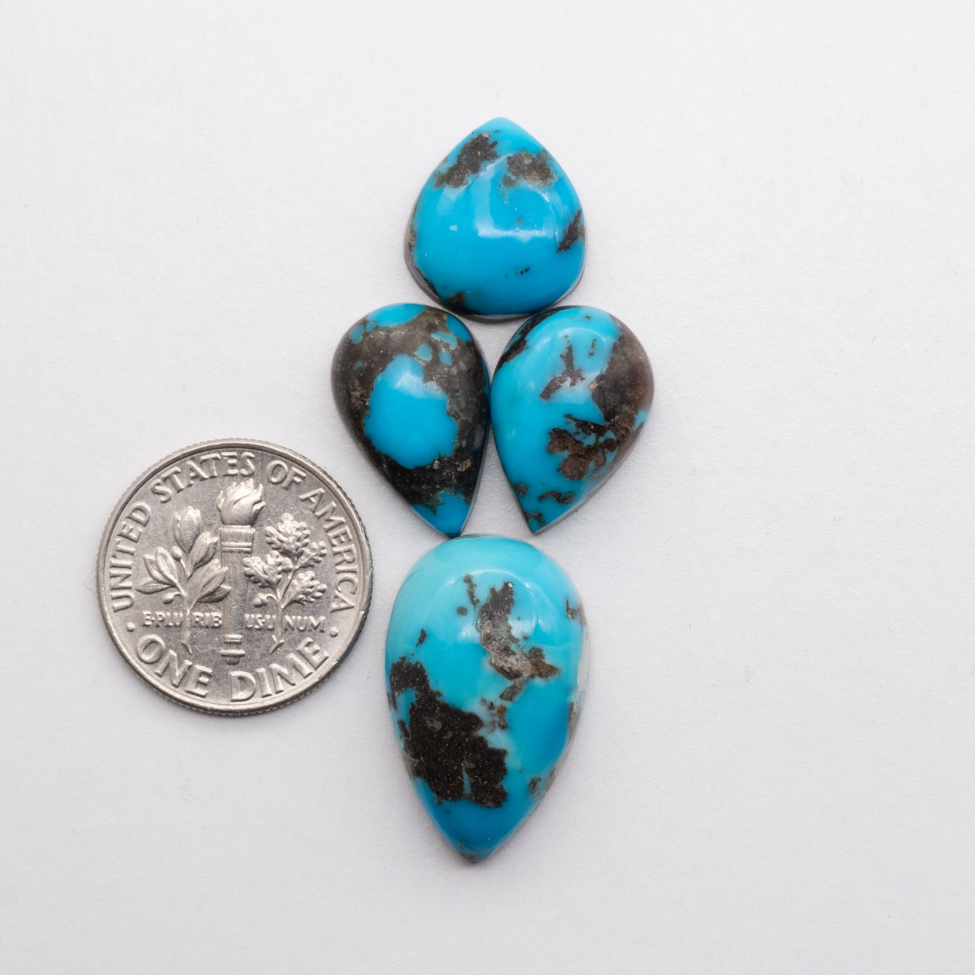 Add unique splashes of color to your jewelry with our Kingman Turquoise. Featuring natural blue hues, these cabochons offer a beautiful contrast to any design. These cabochons are backed for added strength, perfect for necklaces, earrings, and more!