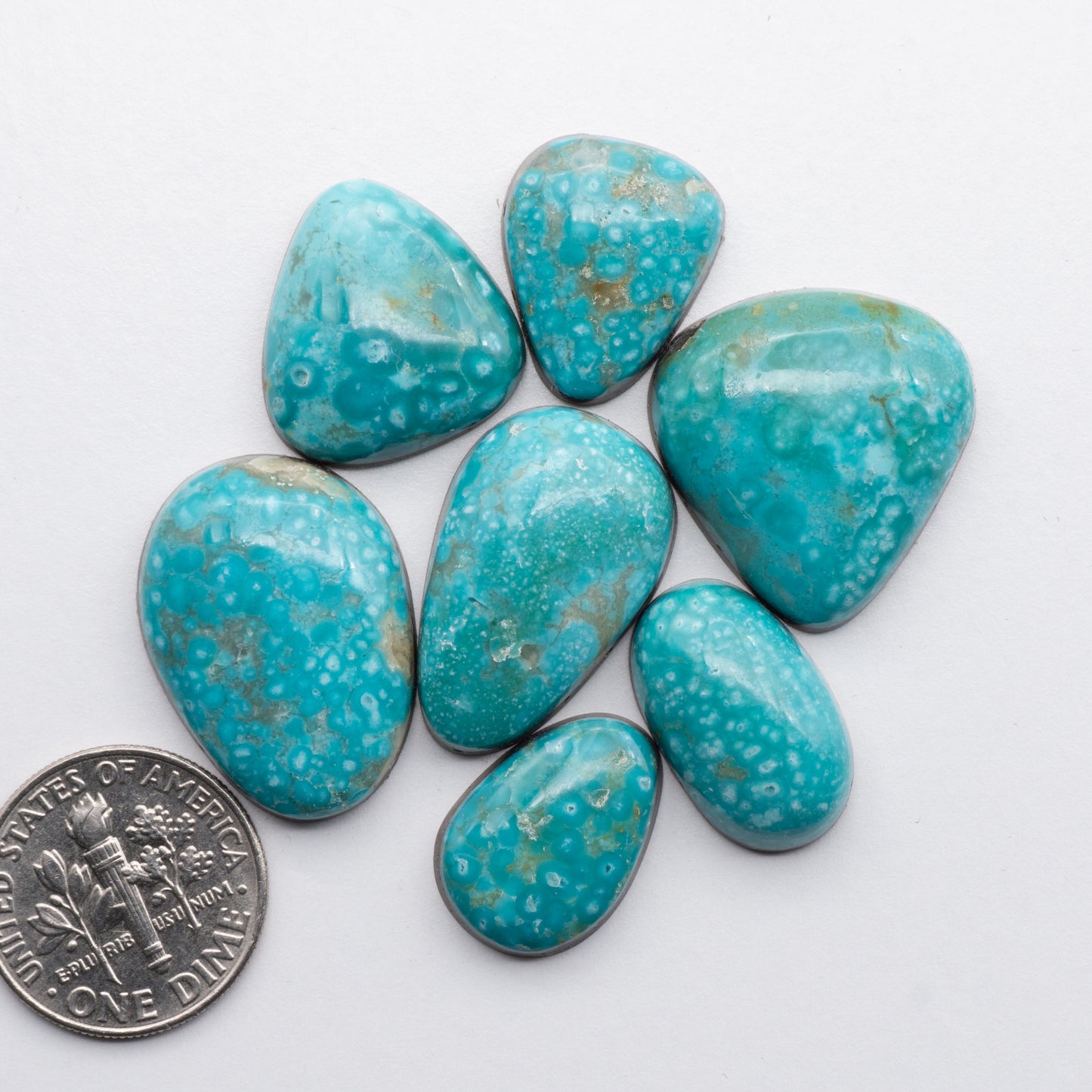 Cumpas Turquoise cabochons have a glossy finish and are backed for added strength. Cumpas Turquoise is mined in Sonora, Mexico.