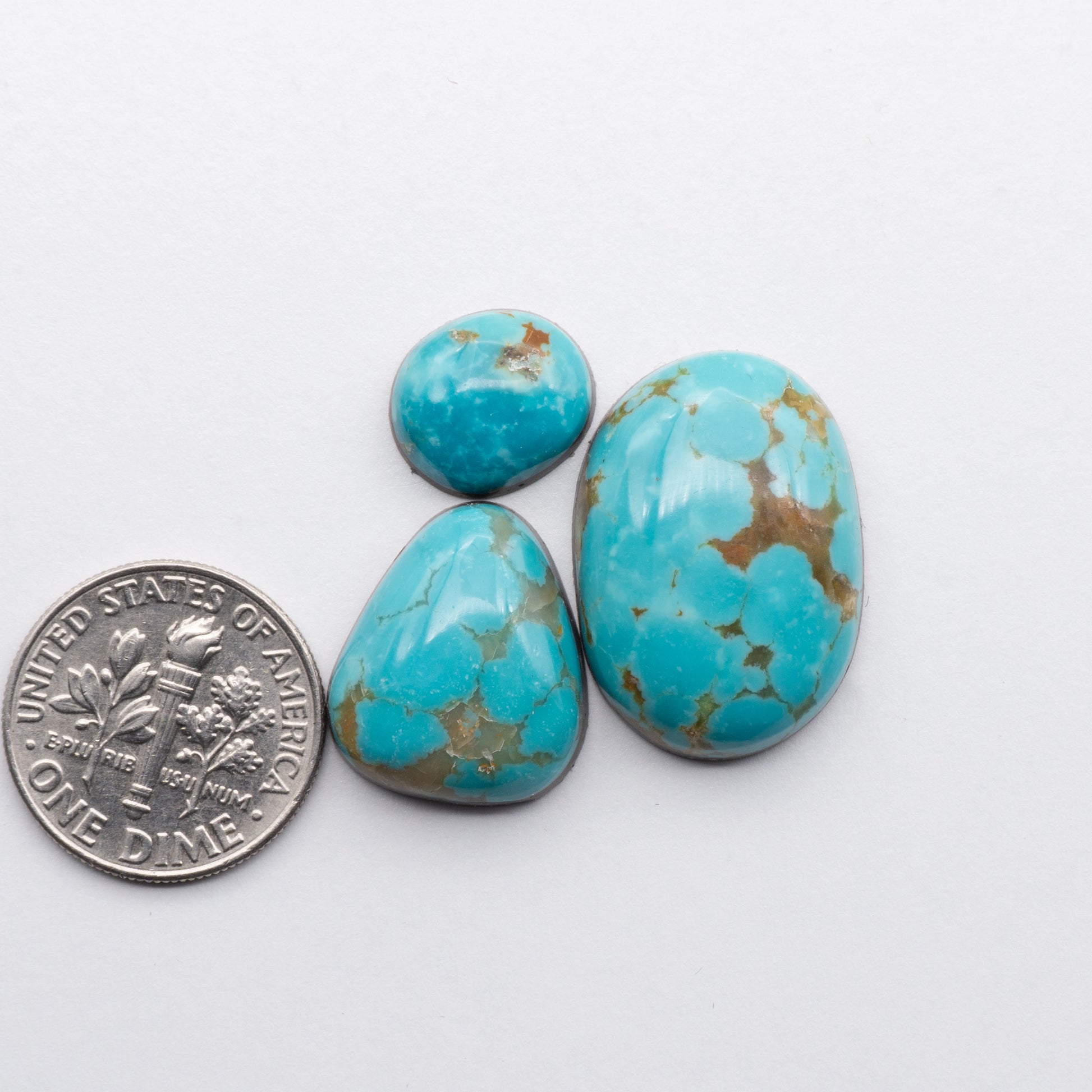 Cumpas Turquoise cabochons have a glossy finish and are backed for added strength. Cumpas Turquoise is mined in Sonora, Mexico.