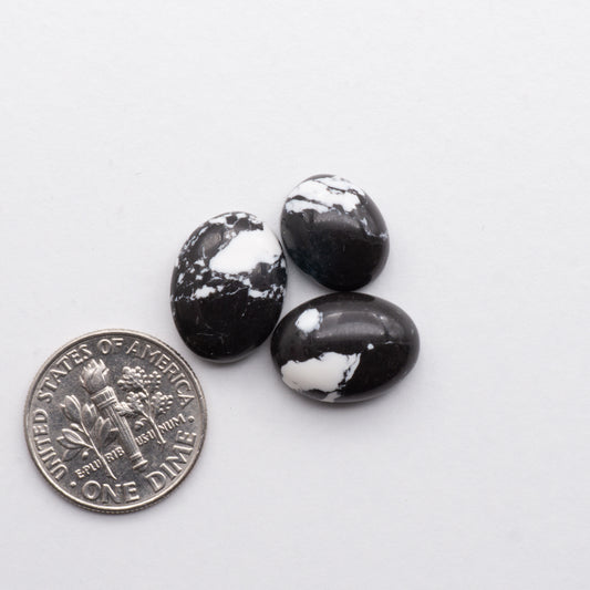 These White Buffalo Cabochons are expertly cut and polished from composite material to create a stunning and durable gemstone. Backed for added strength.