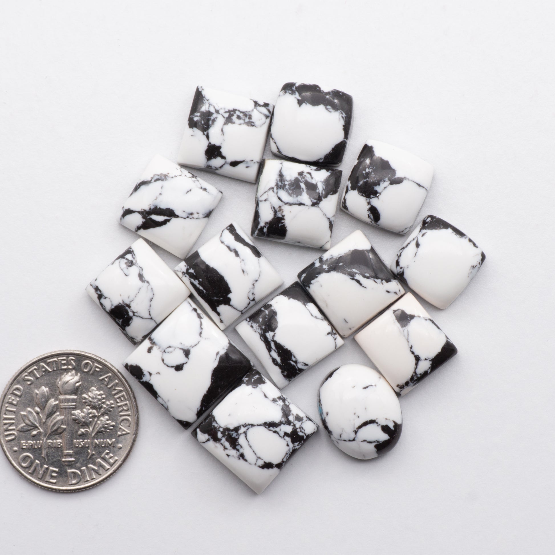 These White Buffalo Cabochons are expertly cut and polished from composite material to create a stunning and durable gemstone. Backed for added strength.