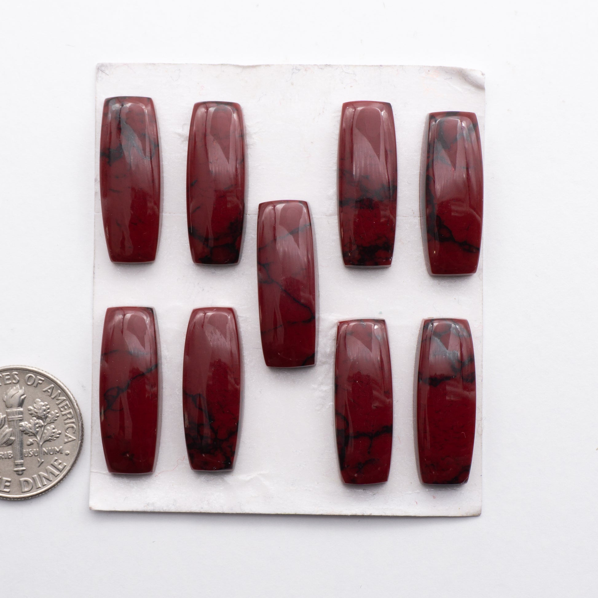 Bloody Bison Jasper is a composite stone  with a vibrant red hue and black matrix that creates a strong impression.