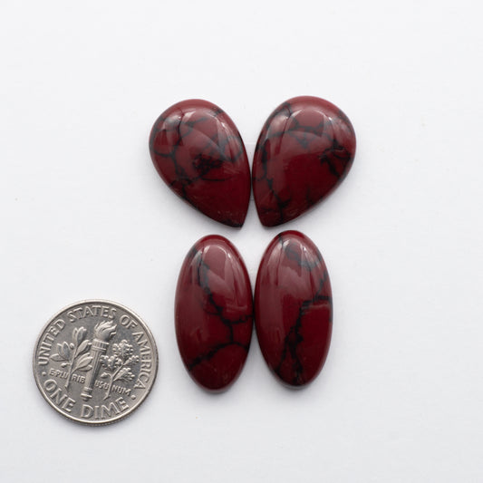 Bloody Bison Jasper is a composite stone  with a vibrant red hue and black matrix that creates a strong impression