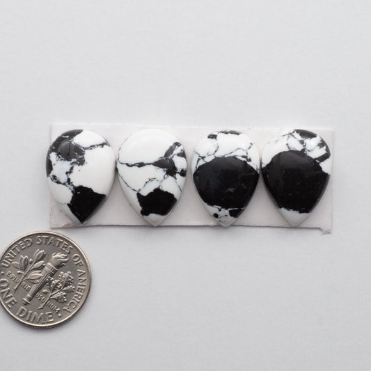White Buffalo Cabochons are expertly cut and polished from composite material to create a stunning and durable gemstone. These stones measure13x18 mm and are unbacked.