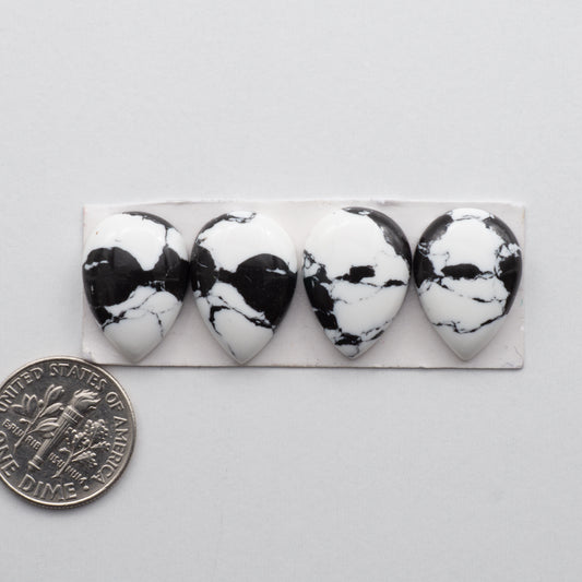 White Buffalo Cabochons are expertly cut and polished from composite material to create a stunning and durable gemstone. These stones measure13x18 mm and are unbacked.