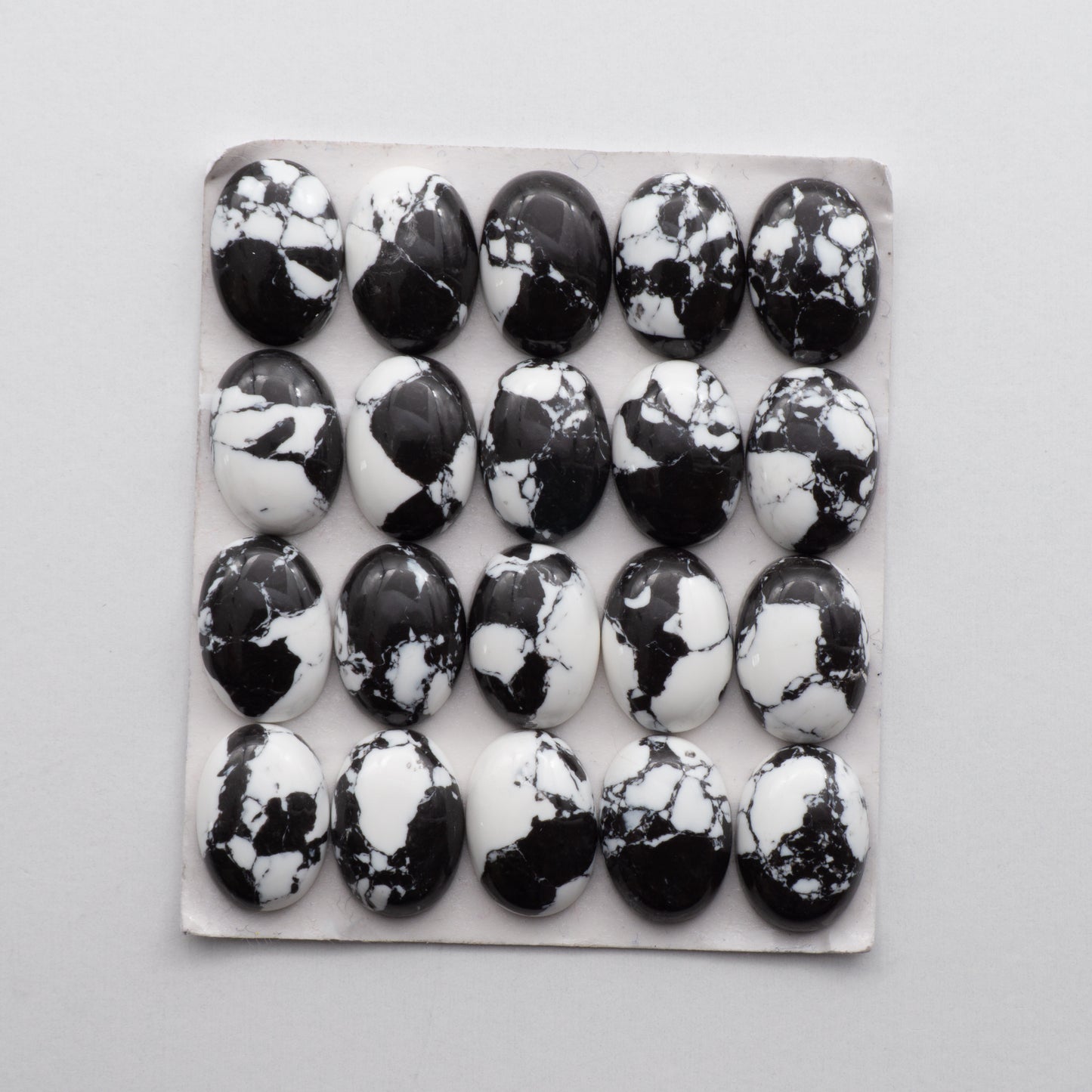 White Buffalo Cabochons are expertly cut and polished from composite material to create a stunning and durable gemstone. These stones  are unbacked.