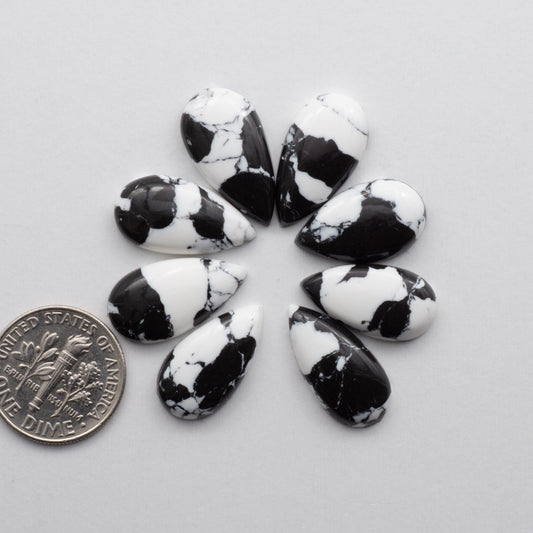 White Buffalo Cabochons are expertly cut and polished from composite material to create a stunning and durable gemstone. These stones are unbacked.