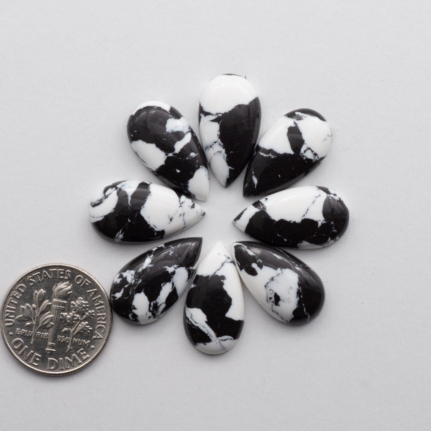 White Buffalo Cabochons are expertly cut and polished from composite material to create a stunning and durable gemstone. These stones are unbacked.