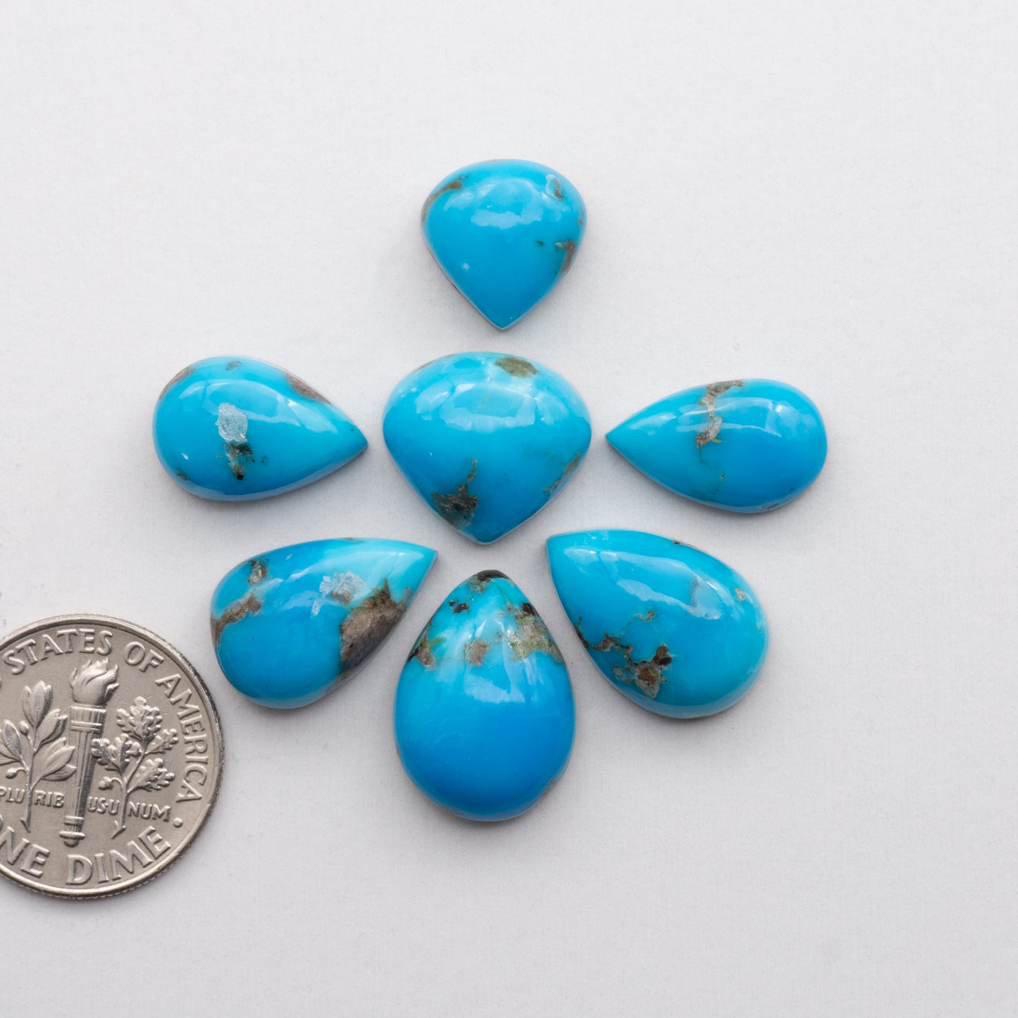 Kingman Turquoise Cabochons are a staple in the jewelry industry, known for their stunning blue-green color and durability. 