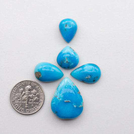 Kingman Turquoise Cabochons are a staple in the jewelry industry, known for their stunning blue-green color and durability. 
