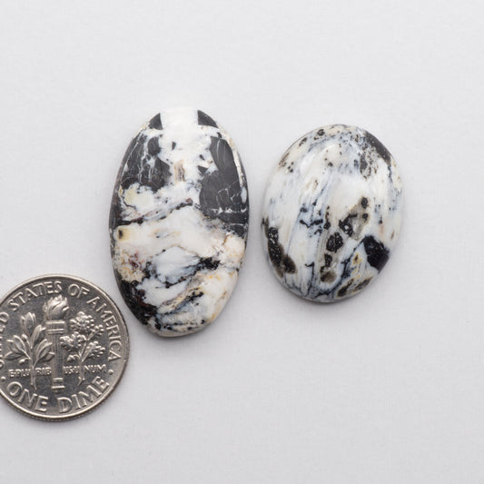 These Natural White Buffalo Stone Cabochons are semi-precious gemstones cut into shapes ideal for jewelry-making and crafting and are backed for added strength
