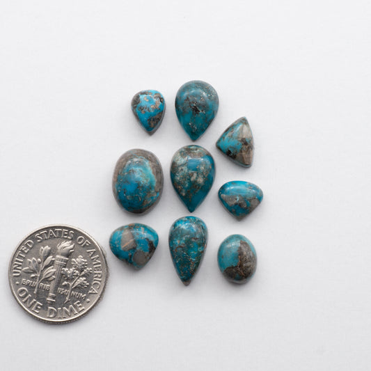 Kingman Turquoise Cabochons are a staple in the jewelry industry, known for their stunning blue-green color and durability