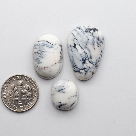 These Natural White Buffalo Stone Cabochons are semi-precious gemstones cut into shapes ideal for jewelry-making