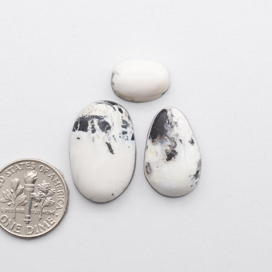 These Natural White Buffalo Stone Cabochons are semi-precious gemstones cut into shapes ideal for jewelry-making 