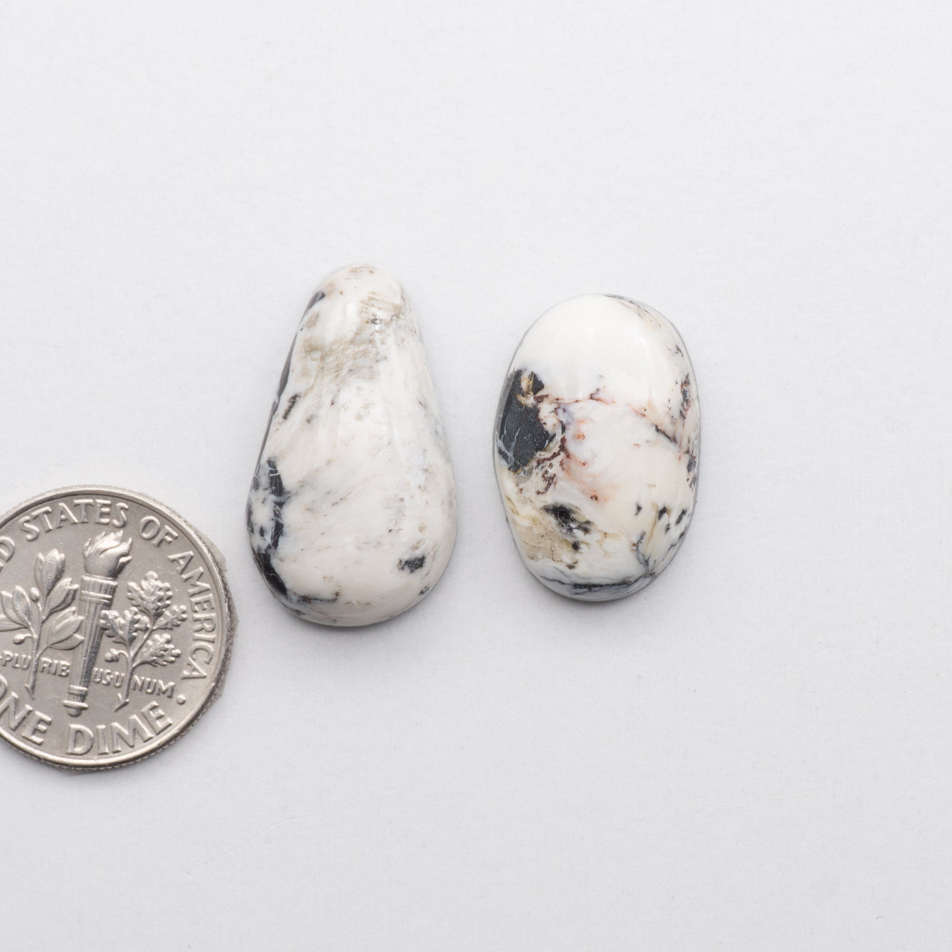 These Natural White Buffalo Stone Cabochons are semi-precious gemstones cut into shapes ideal for jewelry-making 
