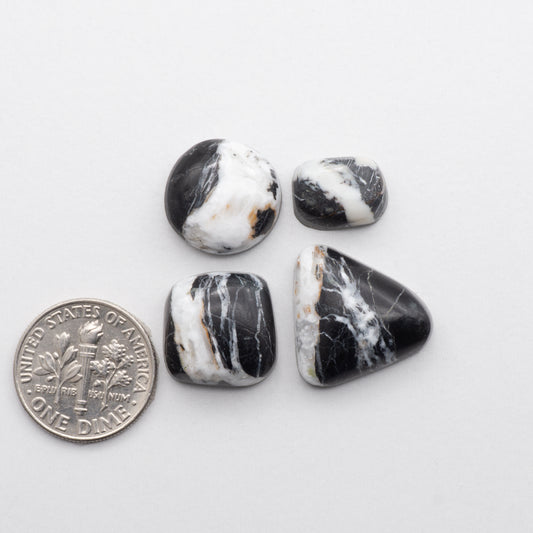 These Natural White Buffalo Stone Cabochons are semi-precious gemstones cut into shapes ideal for jewelry-making 