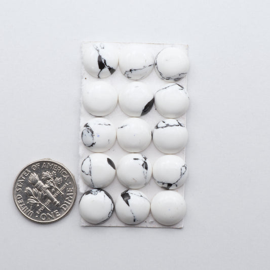 White Buffalo Cabochons are expertly cut and polished from composite material to create a stunning and durable gemstone.