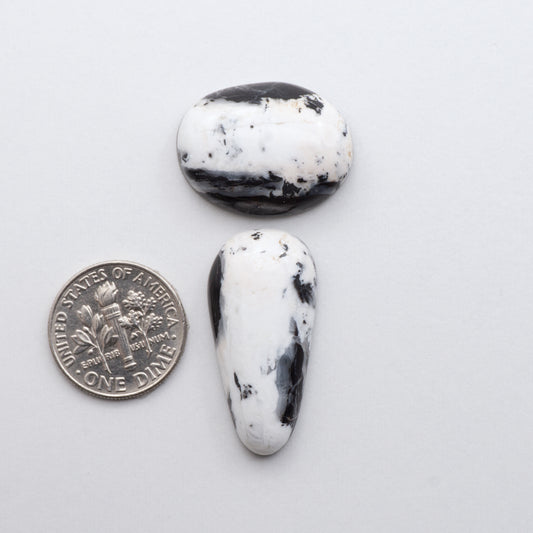 These Natural White Buffalo Stone Cabochons are semi-precious gemstones cut into shapes ideal for jewelry-making and are backed for added strength.