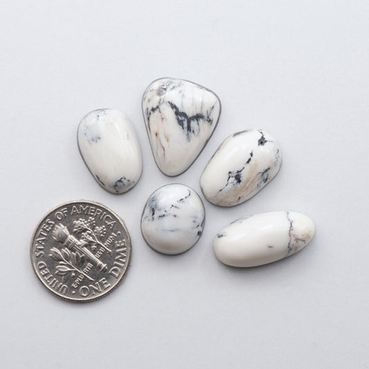 These Natural White Buffalo Stone Cabochons are semi-precious gemstones cut into shapes ideal for jewelry-making and are backed for added strength.