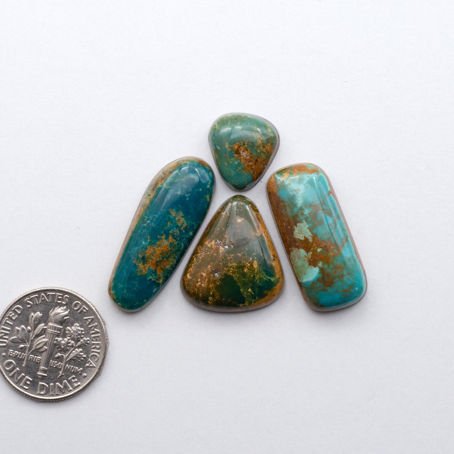 Royston Ribbon Turquoise cabochons are renowned for their unique shades of green, blues, making these cabochons a popular choice for jewelry makers