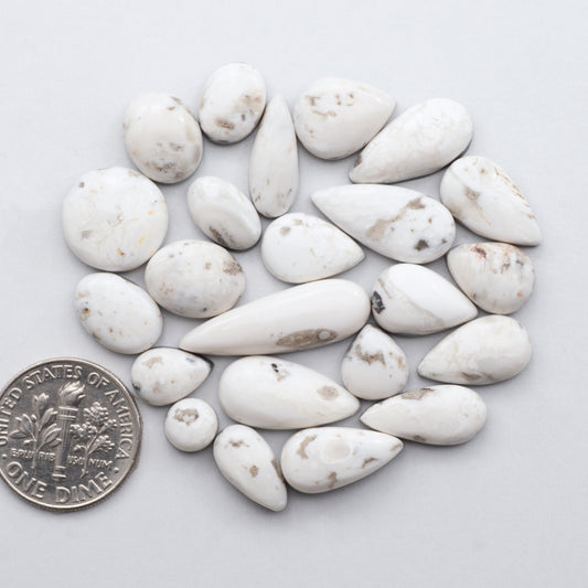 Natural White Buffalo Stone Cabochons are hand-cut semi-precious gemstones perfect for making unique and high-quality jewelry.