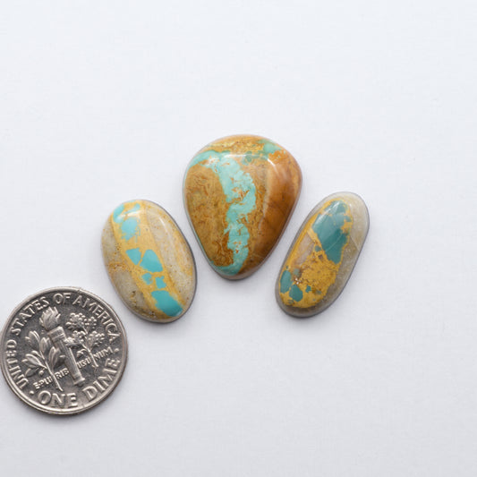 Royston Ribbon Turquoise cabochons are renowned for their unique shades of green, blues, making these cabochons a popular choice for jewelry makers.