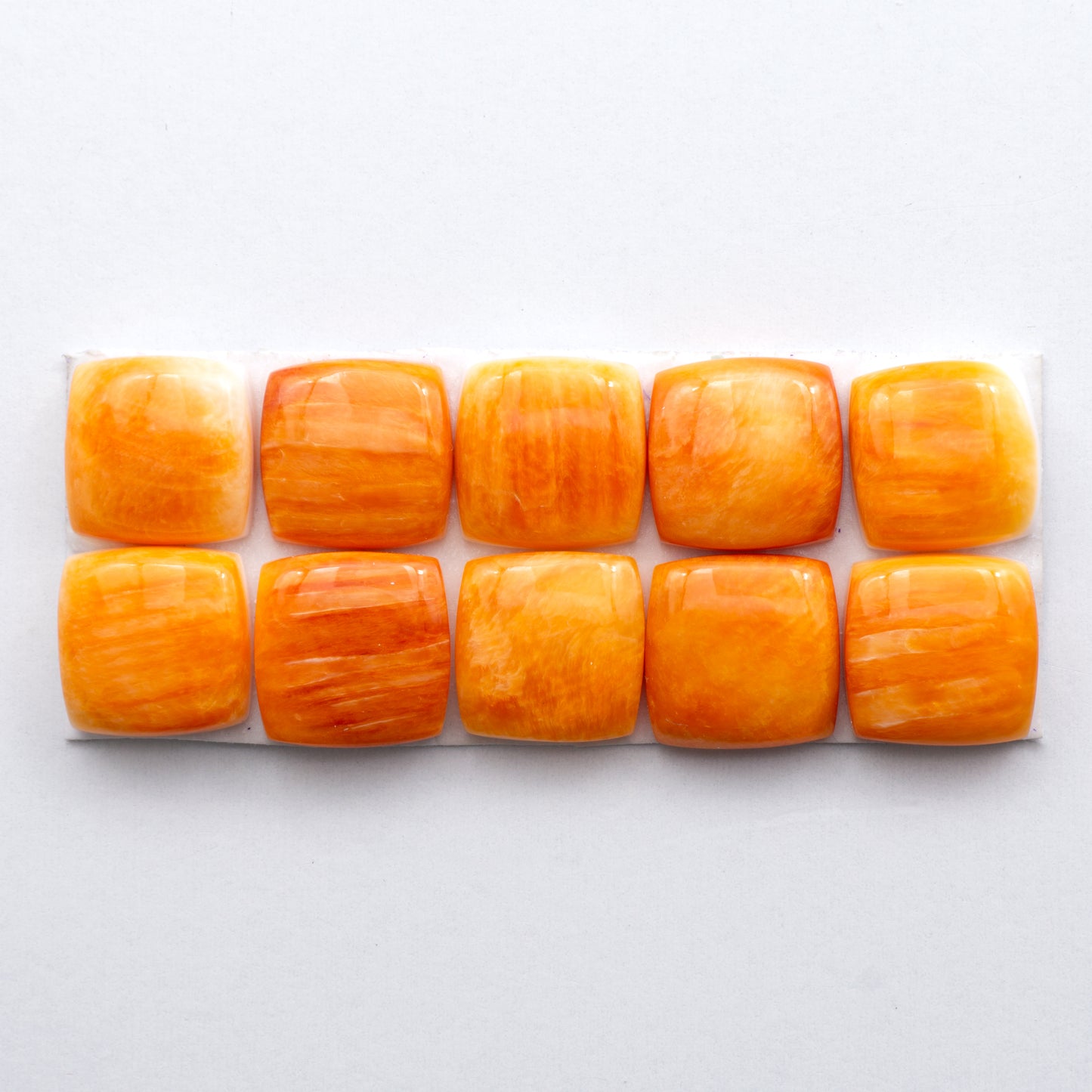 Add a unique, natural touch to your jewelry designs with our Orange Spiny Oyster Cabochons.
