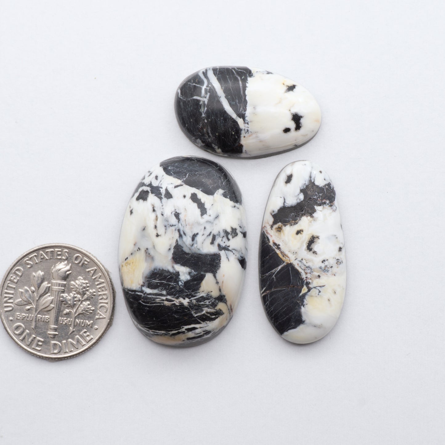 These Natural White Buffalo Stone Cabochons are semi-precious gemstones cut into shapes ideal for jewelry-making 