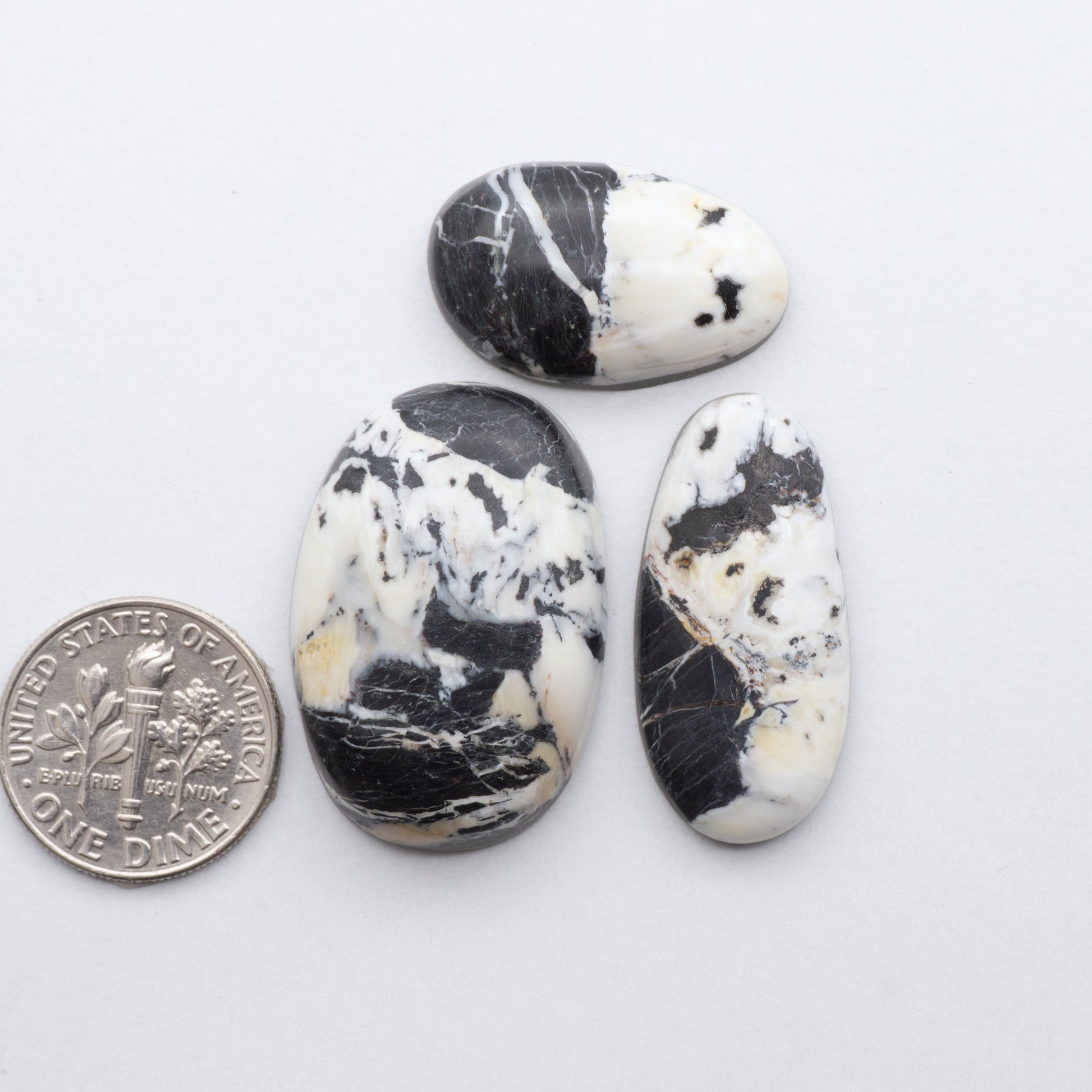 These Natural White Buffalo Stone Cabochons are semi-precious gemstones cut into shapes ideal for jewelry-making 