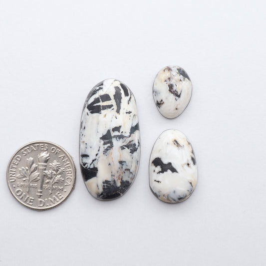 These Natural White Buffalo Stone Cabochons are semi-precious gemstones cut into shapes ideal for jewelry-making 