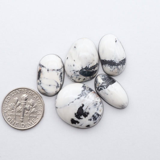 These Natural White Buffalo Stone Cabochons are semi-precious gemstones cut into shapes ideal for jewelry-making 
